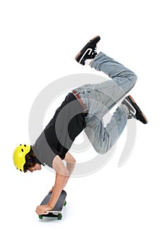 Teen Boy With Skateboard Over White Doing Hand Stand