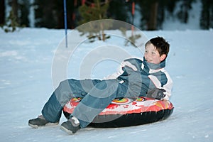 Teen boy on sled