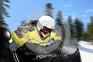 Teen boy on snowmobile