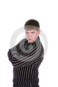 Teen boy in striped shirt with arms crossed