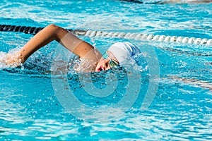 Teen boy at swimming practice.