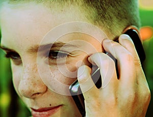 Teen boy talking on cell phone