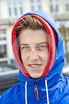 Teen boy wearing an anorak outside photo