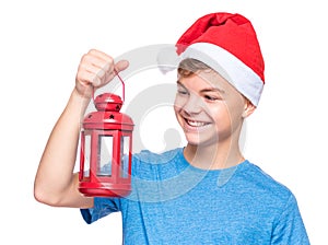 Teen boy wearing Santa Claus hat