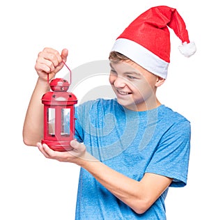 Teen boy wearing Santa Claus hat