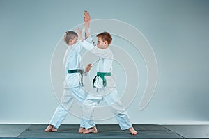 The two boys fighting at Aikido training in martial arts school. Healthy lifestyle and sports concept