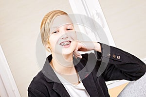 Teen with braces on his teeth.