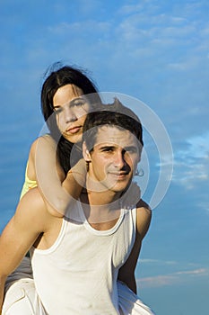 Teen couple in piggy back