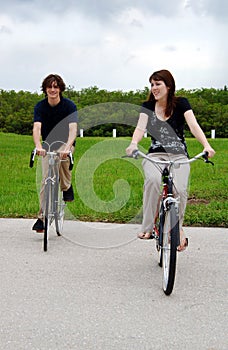 Teen couple riding bikes