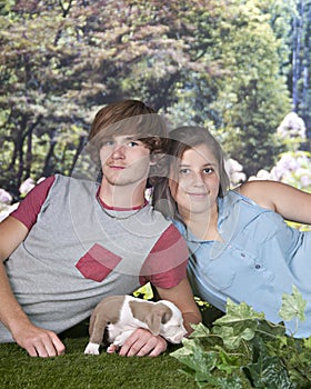 Teen Couple with Young Pup photo