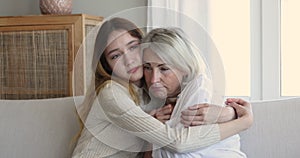 Teen daughter cuddle sad mother, consoling, helps get through divorce