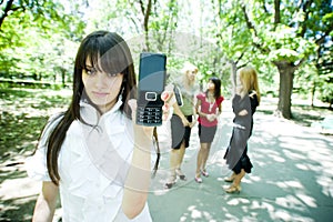 Teen displaying cell phone photo