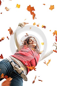 Teen with falling leaves photo