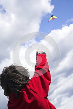 Teen flying kite