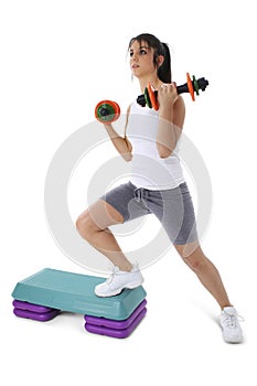 Teen Girl On Aerobic Step With Hand Weights