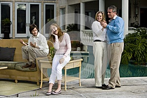 Teen girl amused by parents dancing