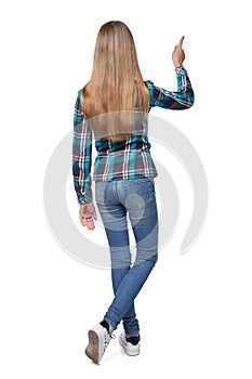 Teen girl in checkered shirt standing casually