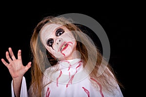 Teen girl in costume on zombie.