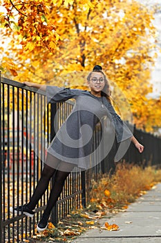 Teen girl dancing in the autumn street