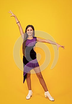 Teen girl dancing rumba, samba cha-cha-cha. Ballroom dance school for teenager kids girl. Dress movement. Ballroom sport