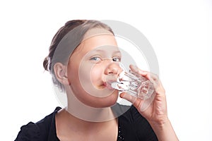 Teen girl drinking water from glass