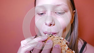 Teen girl eating a burger