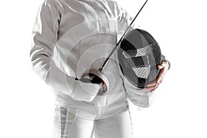 Teen girl in fencing costume with sword in hand isolated on white background photo
