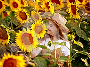 12 year old girl on a field of sunflowers photo