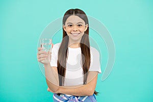 teen girl going to drink mineral beverage. healthy childhood lifestyle. water balance in body.