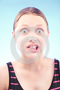 Teen girl grimacing