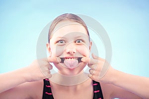 Teen girl grimacing