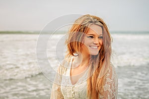 Teen girl happy at the beach