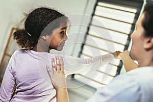 Teen Girl having chiropractic back adjustment.