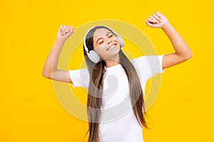 Teen girl in headphones listen to music. Wireless headset device accessory. Child enjoys the music in earphones on