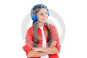 Teen girl in headphones listen to music. Wireless headset device accessory. Child enjoys the music in earphones on white