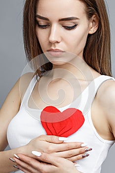 Teen girl hold red heart. valentine day