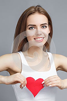 Teen girl hold red heart. valentine day