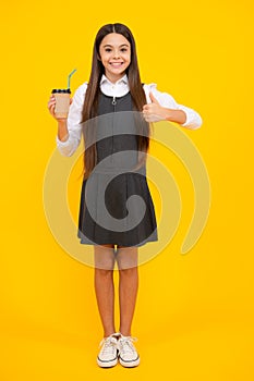 Teen girl holding coffee cup. Coffee break and recess. Teenager hold plastic take away cup, drink cocoa, coffee or tea
