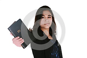 Teen girl holding out Bible