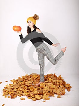 Teen girl holding pumpkin