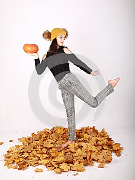 Teen girl holding pumpkin