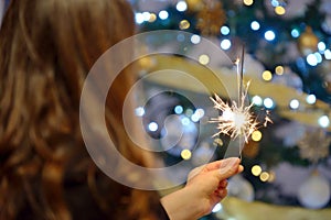 Teen girl holding sparklers