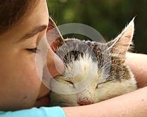 Teen girl hug cat close up portrait