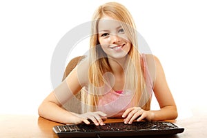 Teen girl with keyboard looking at camera with interest like in