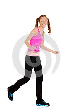 Teen girl laughing doing zumba fitness