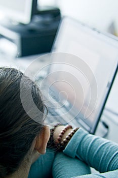 Teen girl learning computers