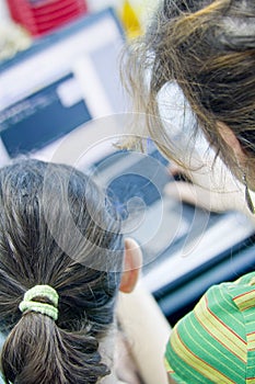 Teen girl learning computers