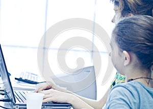 Teen girl learning computers