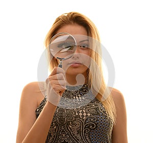 Teen girl with magnifying glass