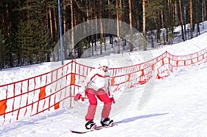 Teen girl makes her first steps on a board